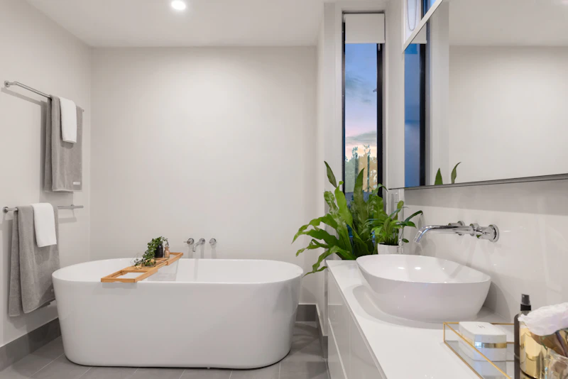 Large custom-style wall mirror above a contemporary bathroom vanity